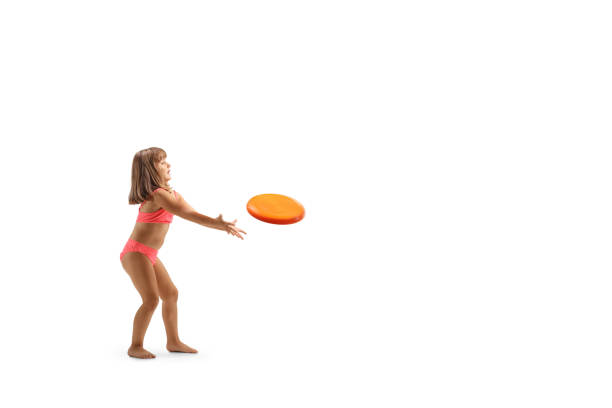 istock Little girl in bikini playing with a flying disk 1689735652