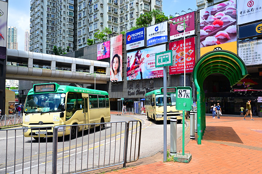 Shenzhen, China - October 22, 2019: BYD Electric Bus driving near train station. Shenzhen, the ultra modern city with 15 million people is located in southern China.