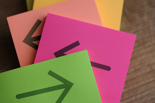 Arrows on adhesive note papers