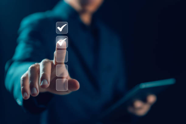 istock the person holding a tablet ticks the checkmark in the box. 1689861821