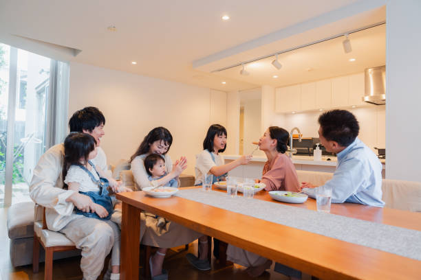 istock Large family eating dinner together 1689862560