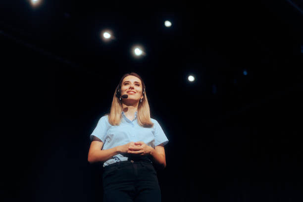 istock Manager Standing on a Stage Motivating the Audience 1689874790