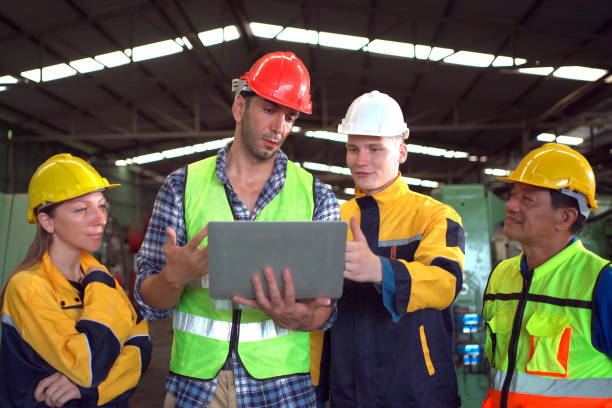 istock Group of foreman - engineer discussing together. 1689881096
