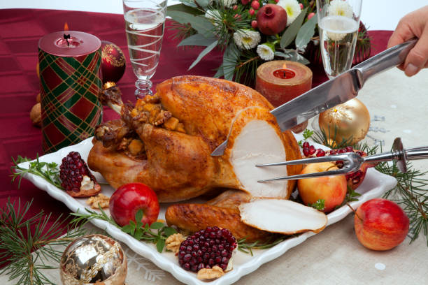 istock Carving Christmas Pomegranate Glazed Roasted Turkey 1689885824