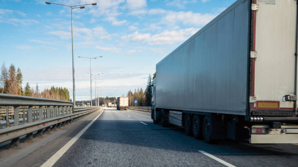 istock Trucks at multiple lane highway. Freight transportation concept. 1689917878