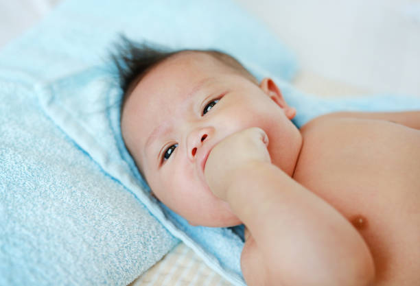 istock Closeup infant baby boy feels teething in his mouth. 1689923005