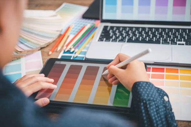 istock Graphic designer architects who work with laptops and color comparison tables for design work. 1689935553