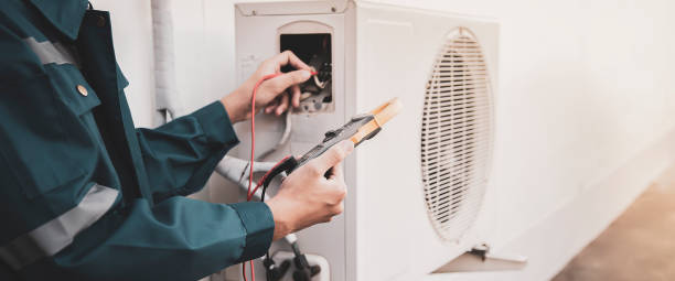 istock Air conditioning, HVAC service technician using gauges to check refrigerant and add refrigerant. 1689938795