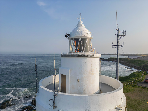 Saint Augustine, Florida, USA- January 3, 2023- Tourists and visitors stand on the outside balcony of the Saint Augustine Lighthouse (1871) for spectacular views of  the area around the northern end of  Anastasia Island