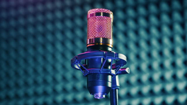Professional microphone in the sound recording booth. Sound production concept.
