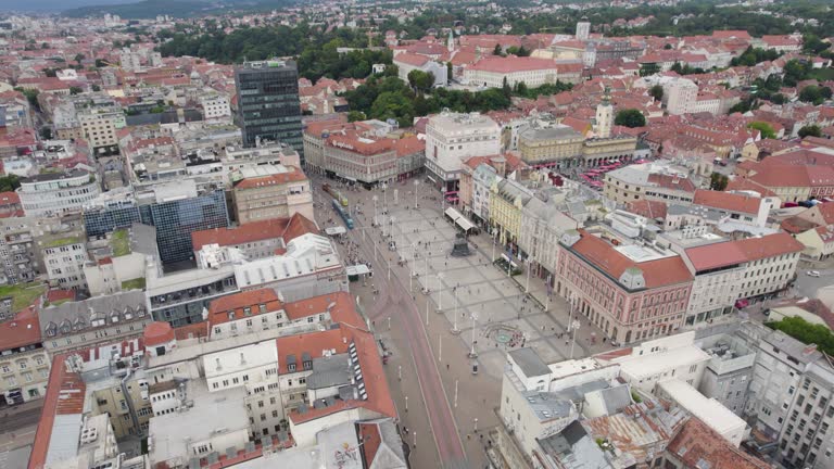 Aerial view circling above Ban Jelačić Square, Zagreb, Croatia old city pedestrian marketplace