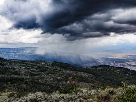Distant downpour over Colorado's Grand Mesa.