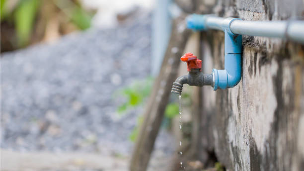 istock Old faucet outside the house dripping 1689989626
