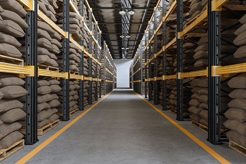 Distribution Warehouse Interior With Sack Of Grains Or Sack Of Coffee On Racks