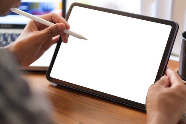 istock Young Asian man sitting on comfortable and using digital tablet. 1689993284