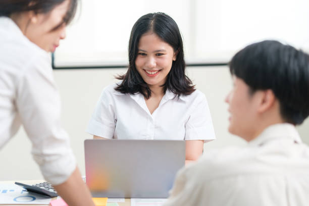 istock Smiling business colleagues working on new project together. 1689993392