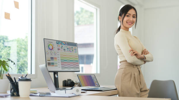 istock Young stylish woman working on design project at modern office. 1690014728