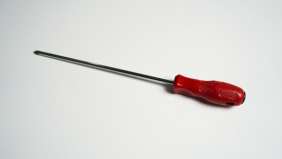 Red screwdriver on white background