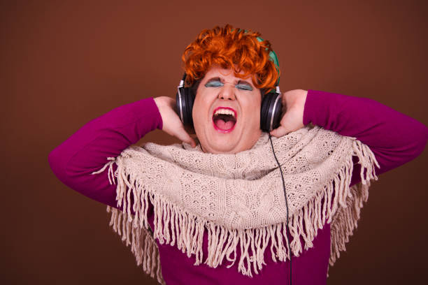 istock Drag queen posing in the studio against a brown background. 1690093707