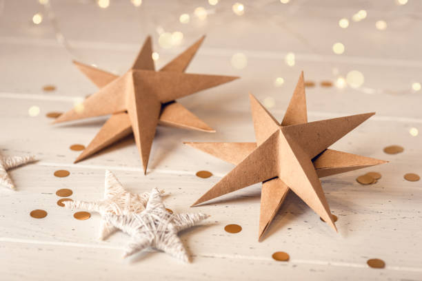 istock Christmas stars on white wooden table. 1690108626