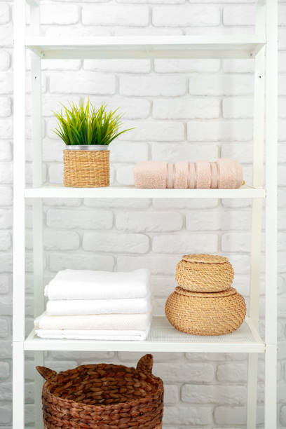 istock Bathroom shelf with towels and baskets in the house 1690125200