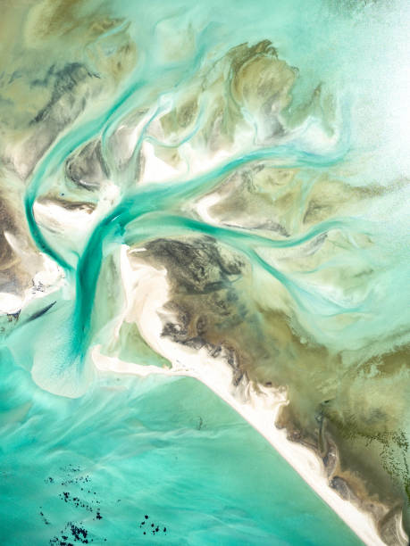 istock Abstract aerial view of sand and water patterns 1690134860