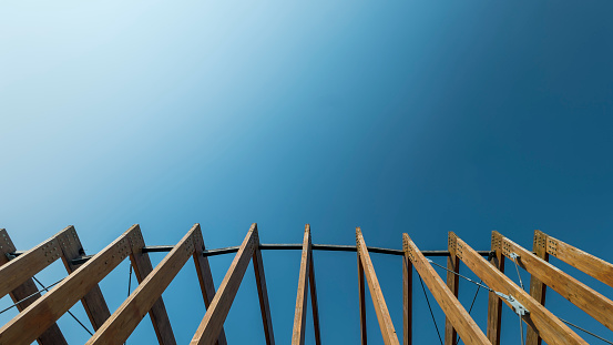 Wooden frames against a clear blue sky background