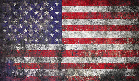 USA flag on textured wall background - American patriotism symbol