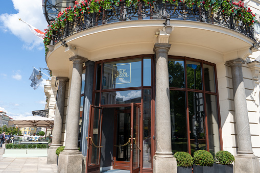 Entrance in Hotel Bristol in the old city of the Polish capital. A beautiful old residential building is a local attraction. Poland, Warsaw - July 27, 2023.