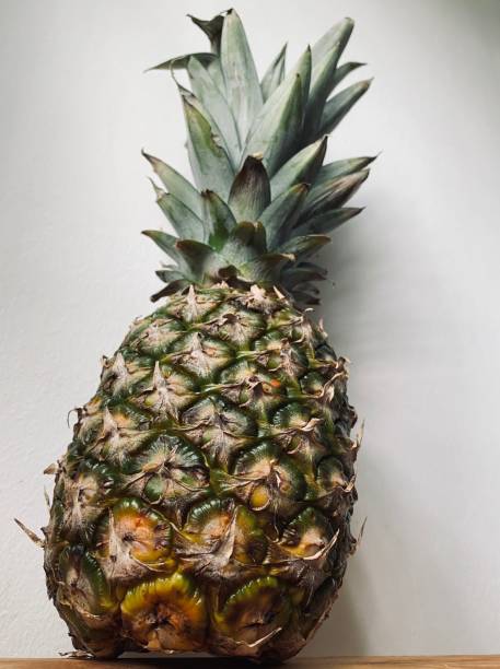 istock Close up whole raw pineapple with white background 1690255106