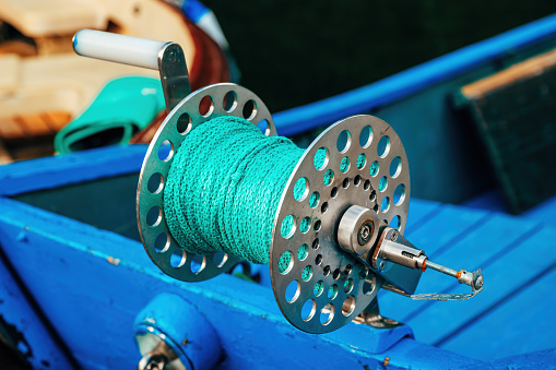 Fishing boat rope coil, closeup with selective focus