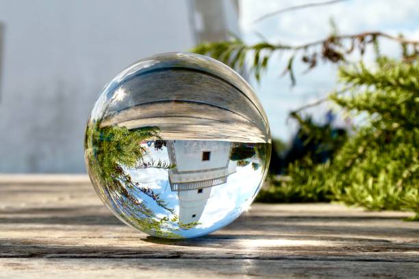 istock Crystal ball against lighthouse 1690265338