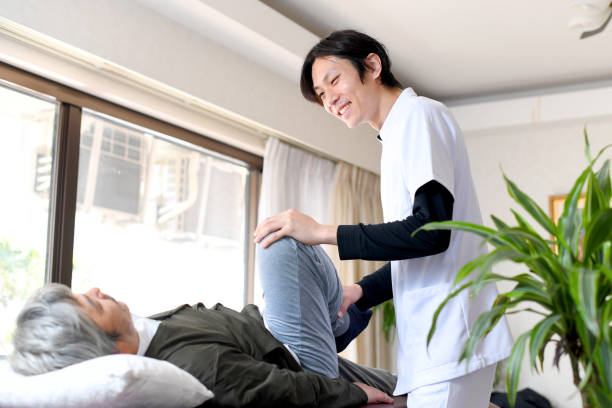 istock Chiropractor giving massage and male patient lying on massage bed 1690271257