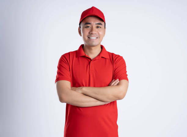istock image of asian delivery man posing on white background 1690271783