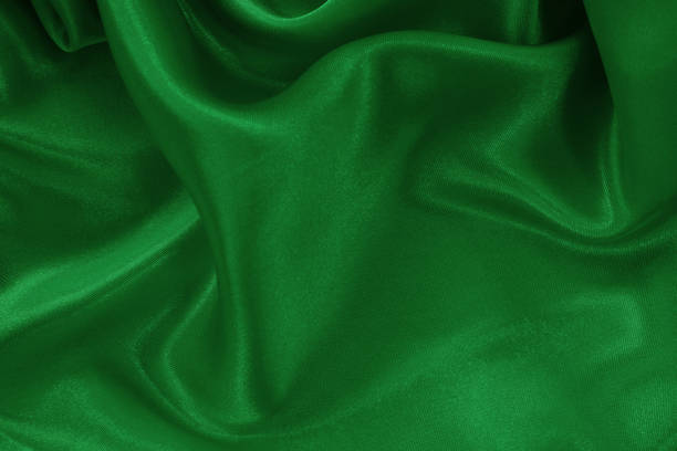 istock Green emerald fabric texture background, detail of silk or linen pattern. 1690285411