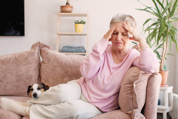 istock middle aged lady looking away sit alone at home feel anxious lonely, sad 1690299469