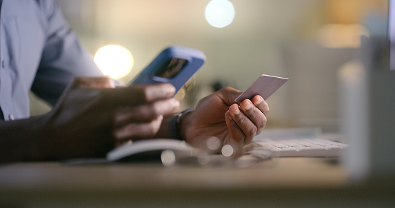 Hands, phone and man with credit card in office for business, startup or loan closeup. Smartphone, zoom and guy manager with online shopping, app or ecommerce, sale or sign up, payment or investment