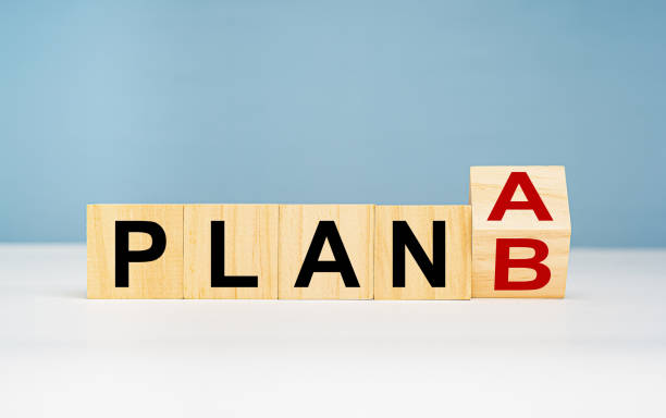 istock Business planning strategy concept. Wooden cubes with words PLAN A change to PLAN B on a table with light blue background 1690309178