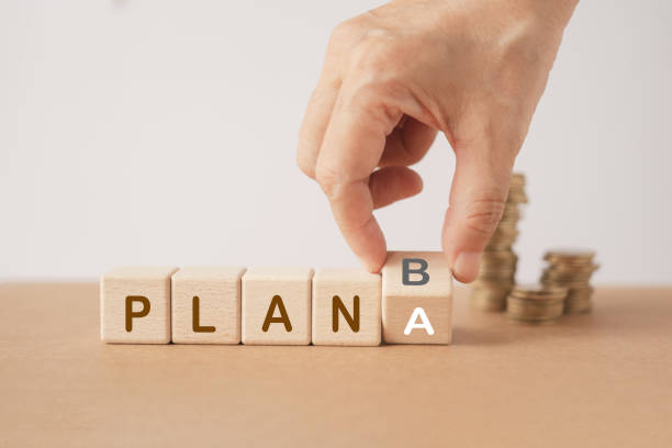 istock hand flip wooden cube block from A to B with plan text on others including copy space. For business strategy, analysis, marketing, project and crisis concept 1690320930