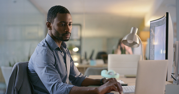 Software designer, engineer or programmer typing on laptop for information technology or cyber security. Computer, search or black man reading web design code for iot digital transformation in office