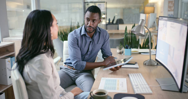 istock Business people, team and computer, tablet or website management, planning and copywriting advice or ideas. Professional writer, editor or manager on digital tech, desktop screen and marketing agency 1690348527