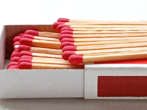 Several boxes filled with matches, a close-up shot. Matchboxes.