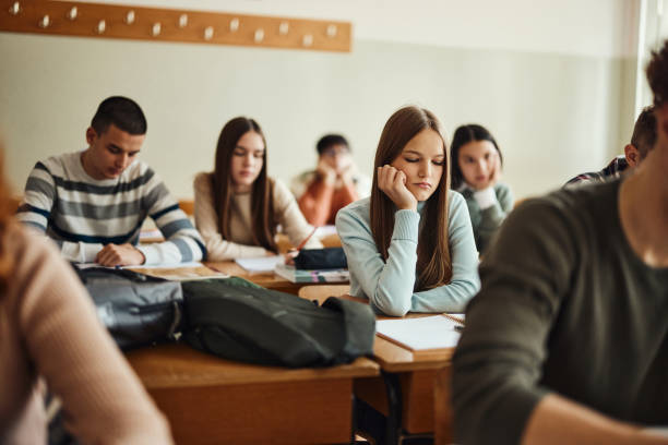 istock Bored teenage student on a class at high school. 1690374732