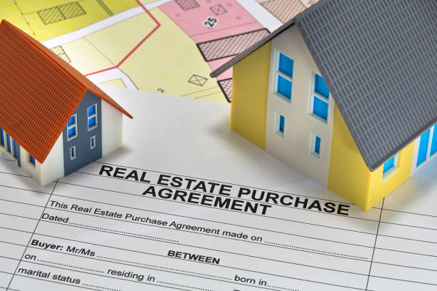 istock Real Estate Purchase Agreement - concept with imaginary cadastral map and residential home model 1690421135