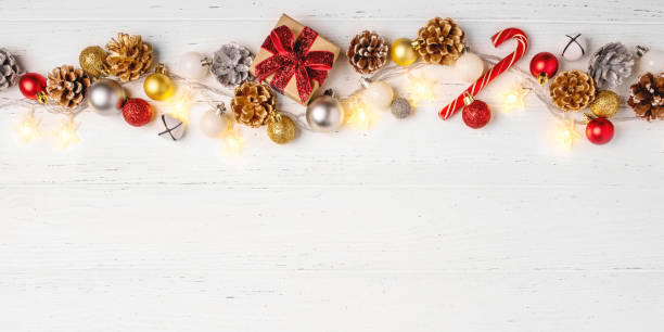 istock Christmas decorations and a gift box on a white table. 1690422187