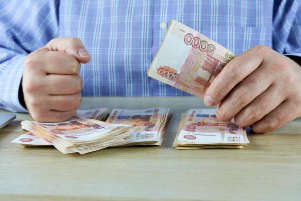 istock A man counting money. Hands with money. Demanding man. 1690433472