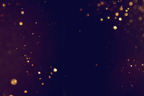 istock Golden abstract bokeh on black background. 1690443786