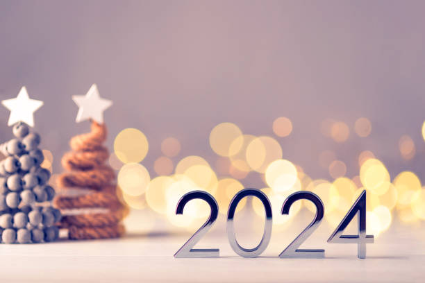 istock Metal numbers 2024 on table with bokeh lights. 1690443832