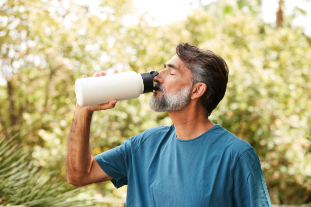 istock A man drinking water from a reusable bottle after sport. 1690447275