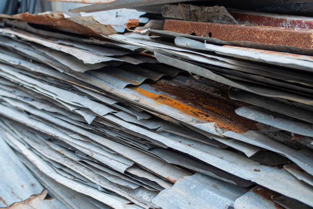 istock Old Galvanized Steel Roofing Sheet from the construction industry for recycling. Rust surface from metal sheets. 1690477428